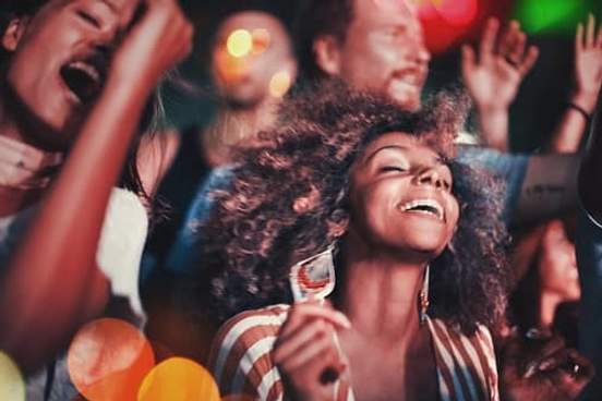 people dancing happily in crowd
