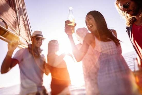 people drinking on a boat