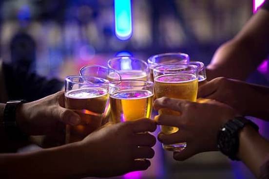 people toasting with drinks