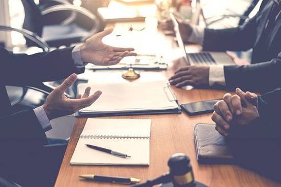 people-talking-across-conference-table