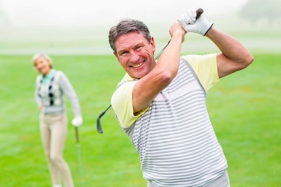 pleased man playing golf
