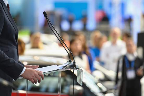 political candidate standing at lectern