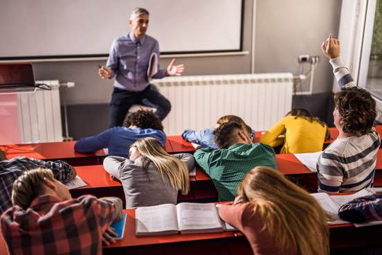 professor addressing sleeping students
