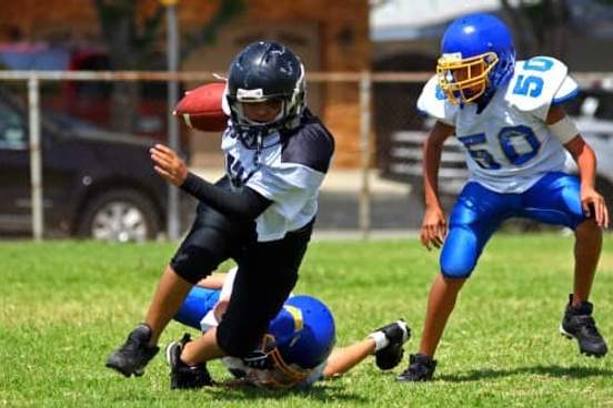 running back breaking tackle