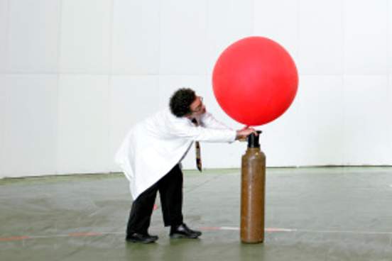 scientist blowing up weather balloon