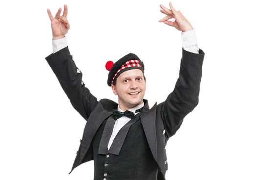scottish man in traditional clothing dancing