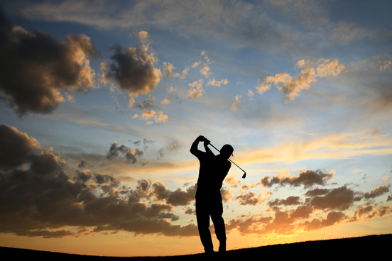 senior golfer at twilight