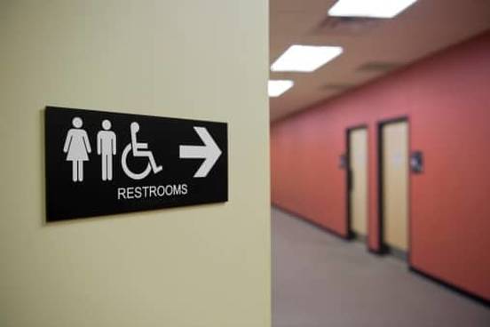 sign pointing to restrooms