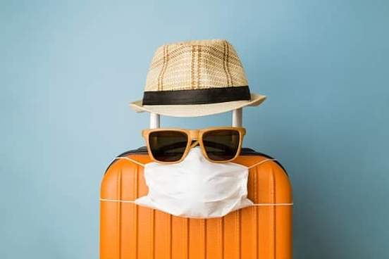 suitcase with mask and sunglasses on it