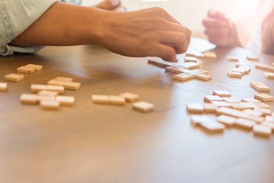 two people playing scrabble
