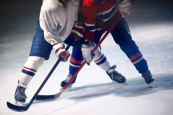 two hockey players locked in struggle
