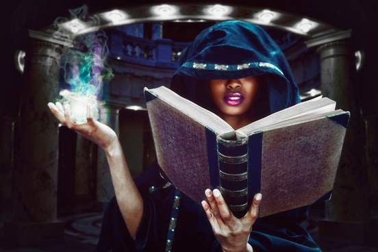 witch reading a spell from a book