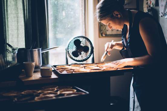 woman making many pies