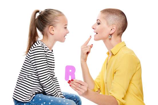 woman teaching child how to pronounce letter r