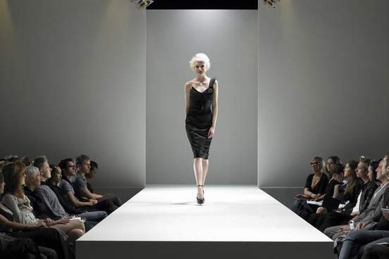 woman walking down the catwalk