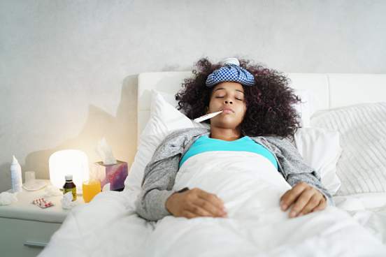 woman-sick-in-bed