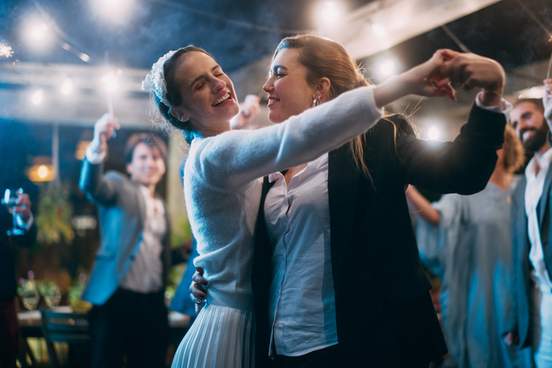 women dancing at their wedding
