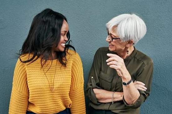 women smiling and talking