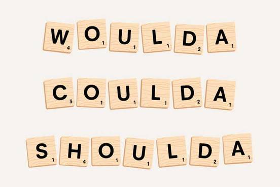 the words woulda, coulda, and shoulda spelled out with scrabble letters