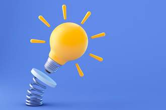 3-d lightbulb with shine lines coming out of it being thrown into the air by a spring