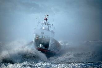 Large ship navigating a strong storm in the ocean