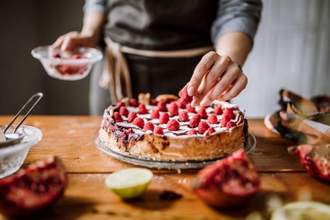 a baker working on a cake