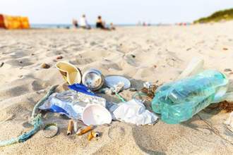 a beach littered with trash