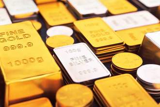 a collection of gold and silver ingots and coins