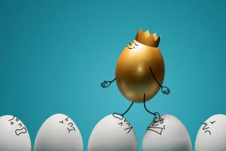 a golden egg with a crown walking on top of the other white eggs
