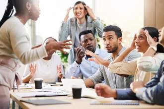 a group of people in an office setting having a heated argument