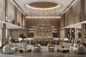 a large beautiful hotel lobby with a bar and seating