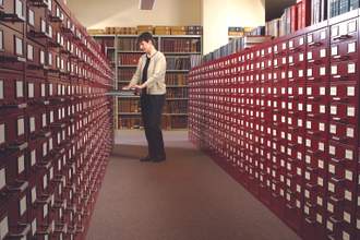 a lexicographer going through files in their office