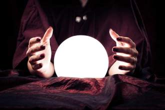 a pair of hands surrounding a light orb