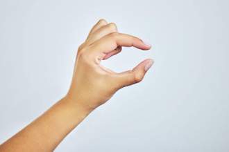 a person gesturing a small size with her hand