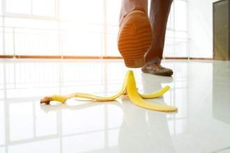 a persons foot about to step on a banana peel