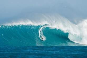 a surfer surfing a huge wave morphing the size difference of the person and nature