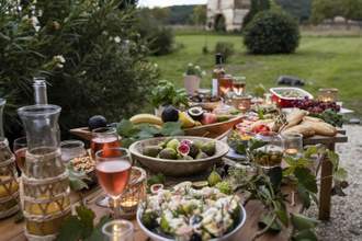 a table set with an assortment of food and drinks