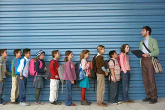 a-teacher-lines-up-students-single-file
