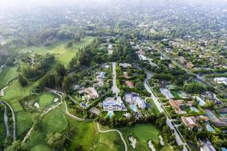 aerial view of a nice neigborhood and golf course nearby