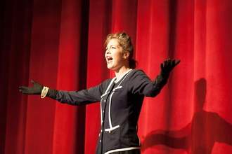 an actress performs on stage