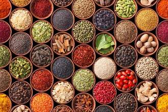 an assortment of spices in small bowls