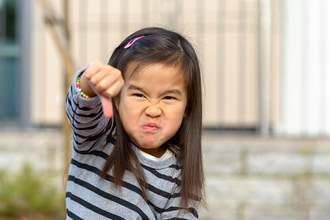angry girl giving thumbs down