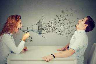 angry young woman with megaphone shouting at stressed scared man blown away by wave of alphabet letters