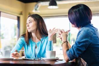 annoyed woman ending conversation with wave of hand