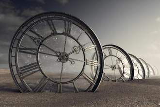 antique clocks laying in the desert