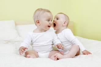 baby shouting into her friends ear