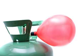 balloon being inflated on a tank