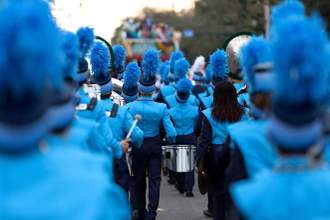 band playing and marching in a parade