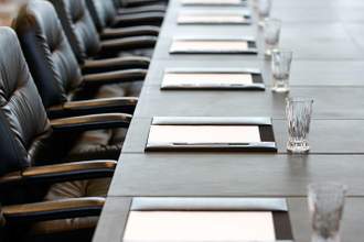 boardroom table is set for a meeting