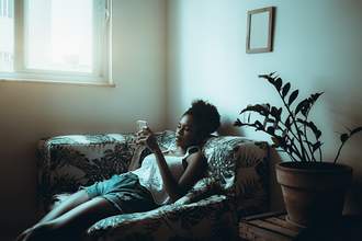 bored woman looks at phone